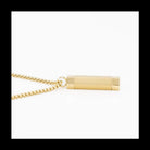 Gold plated cylinder necklace on a white background