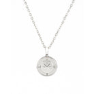 Silver urn necklace with a round compass pendant on a white background