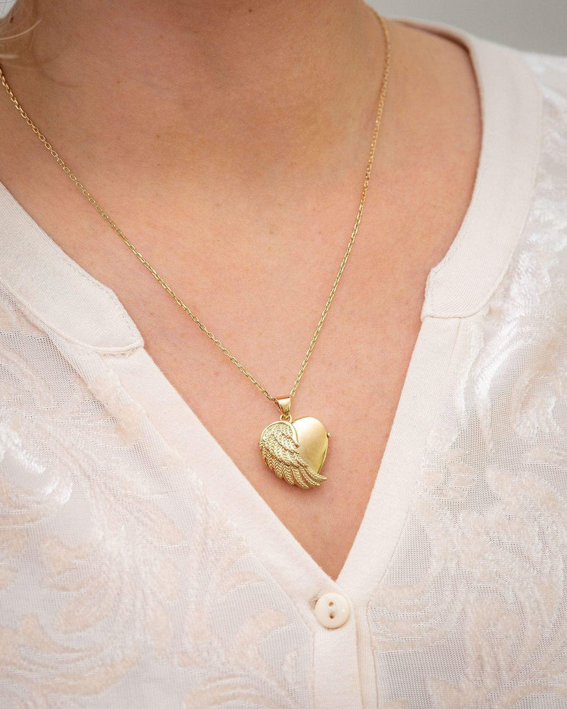 Cara Keepsakes Gold Locket Urns Gold Angel Wing Locket Urn worn on model